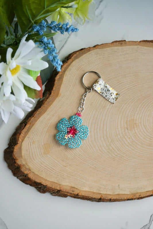 Teal and pink hibiscus flower keychain