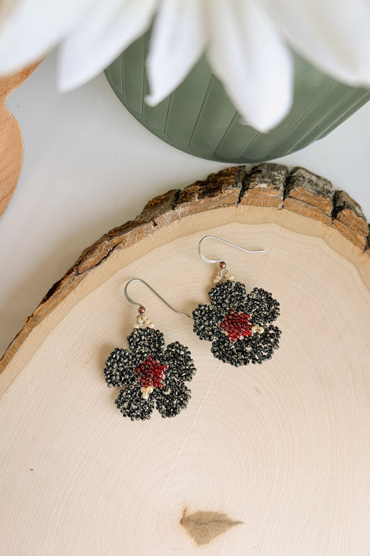 Mottled black hibiscus blooms
