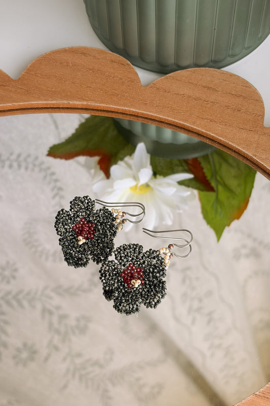Mottled black hibiscus blooms