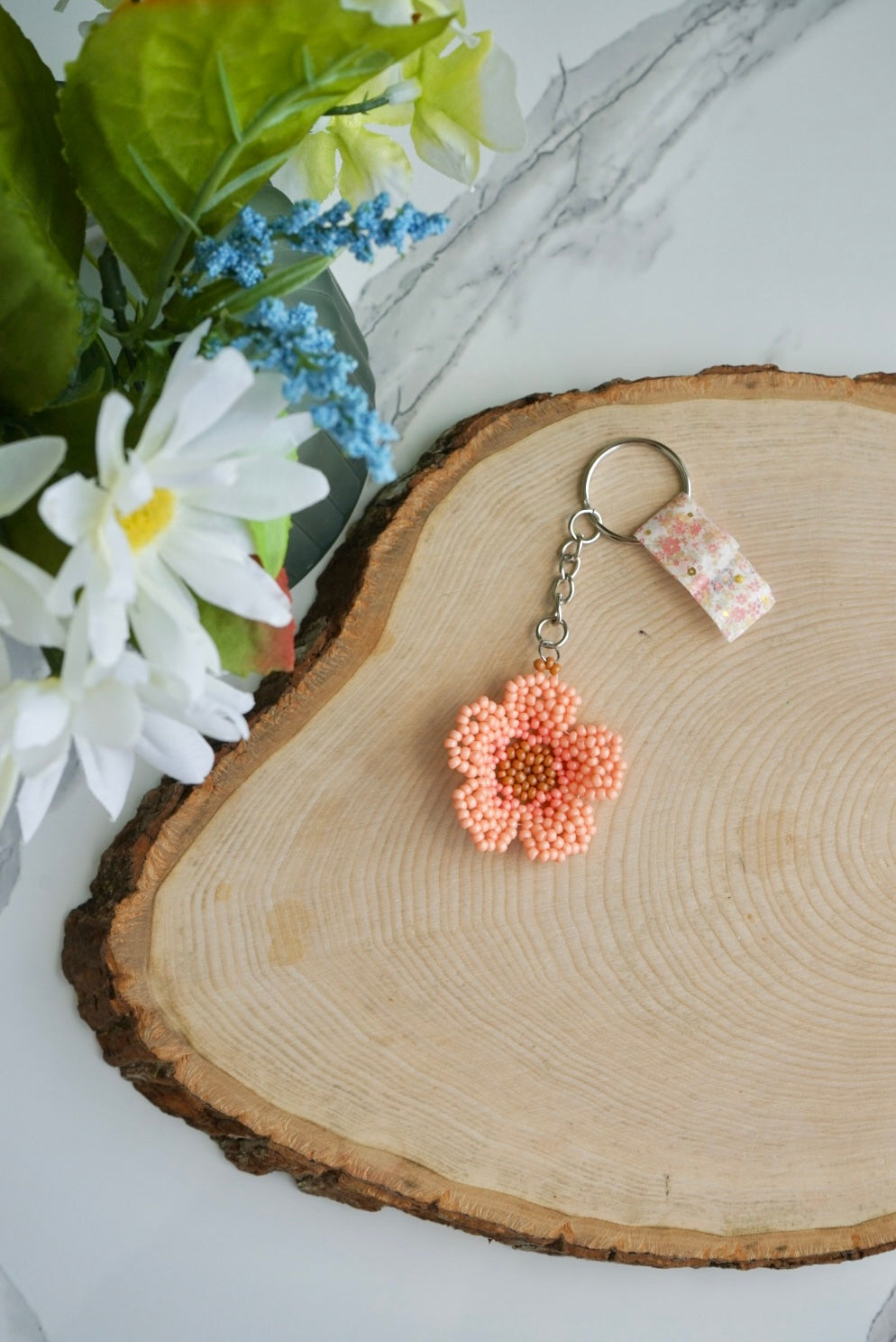 Peach colored flower keychain