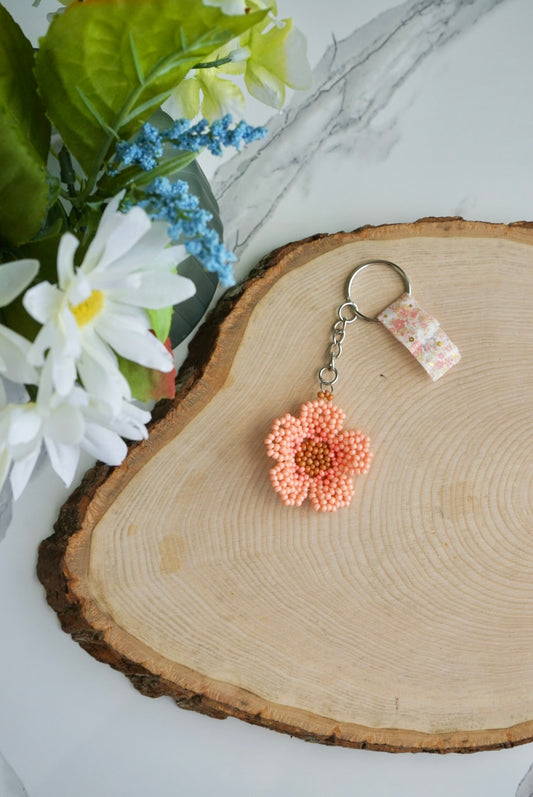 Peach colored flower keychain