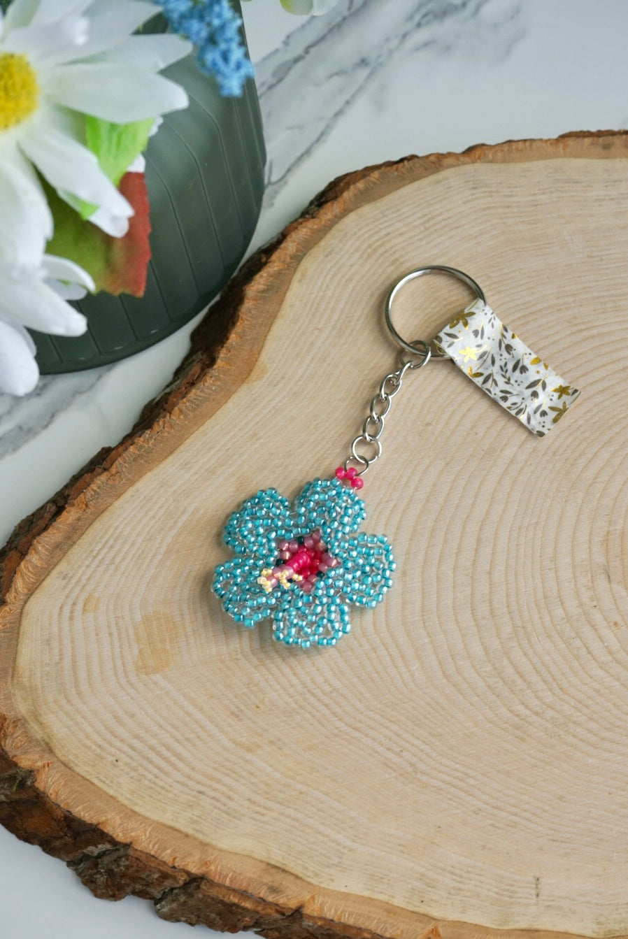 Teal and pink hibiscus flower keychain